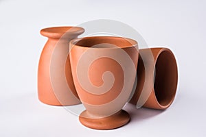 Empty terracotta mug or brown clay coffee cup or jar or drinking glass