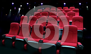 Empty theater auditorium with red seats