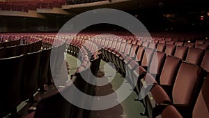 Empty Theater With Comfortable Red Chairs, Cinema Seats in Dark Theatre . Wide shot