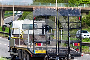 Empty tilt trailer truck on uk motorway in fast motion