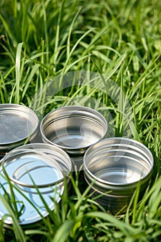 Empty Tins in Grass Recycling