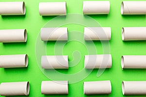 Empty toilet paper roll on colored background. Recyclable paper tube with metal plug end made of kraft paper or