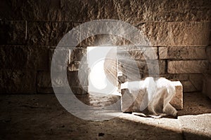 Empty tomb while light shines from the outside. Jesus Christ Resurrection. Christian Easter concept.