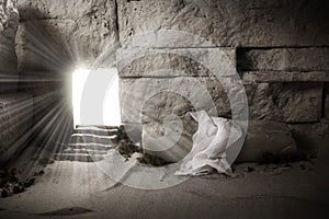Empty tomb while light shines from the outside. Jesus Christ Resurrection. Christian Easter concept. photo