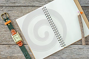 Empty top view of notebook on wooden background with retro style