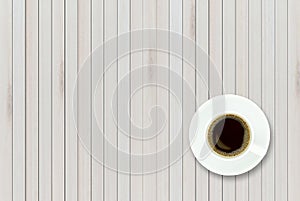 Empty top view of wooden table and black coffee in white ceramic