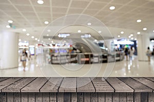 Empty top wood shelves and blurred shopping mall  background. product display template