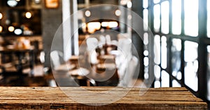 Empty top of wooden shelves on coffee shop ,tree front view background. For product display blur background image, for display