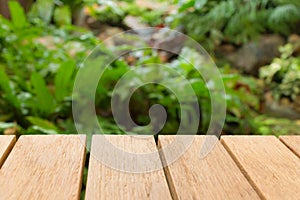 Empty top wooden table and garden background