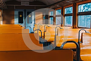 Empty train car without passengers at sunset