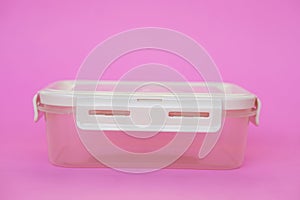 Empty transparent boxes, containers. Pink background