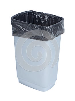 Empty trash container with black plastic bag on white background