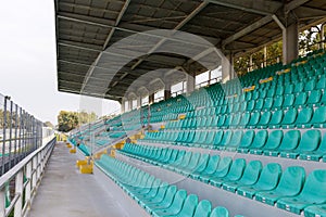 Empty tribune for fans with roof on sunny day