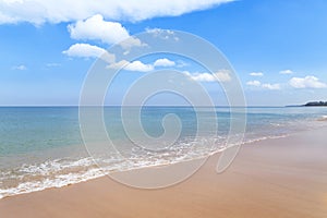 Empty tropical beach and sea with white cloud and blue sky background