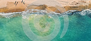 Empty tropical sand beach and azure sea or ocean water aerial top view from drone, panoramic long banner with copy space