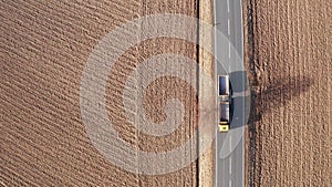 empty truck driving on a country road from above