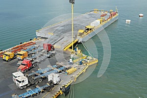 Empty trucks and lorries parked on a loading pier of container terminal in Puerto Barrios .