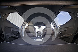 Empty trunk of a modern car with folded rear seats. large interior volume. trunk view