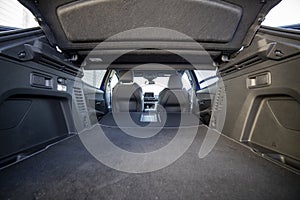 Empty trunk of a modern car with folded rear seats. large interior volume. trunk view