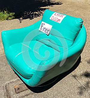 Empty Turquoise Chair For Free on Sidewalk