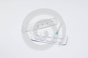 Empty twenty milliliter syringe and a needle  on white background. Medicine, treatments and healthcare. Medical concept.
