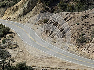 Empty Two-Lane Road Cutting Through Rural California Forest