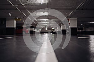 Empty underground parking lanes with reflections. Blurred on purpose and Diminishing perspective