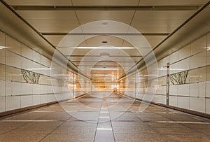 Empty underground passage at night