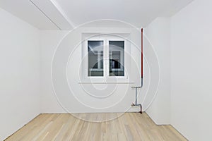 Empty unfurnished room with minimal preparatory repairs. interior with white walls