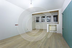 Empty unfurnished room with minimal preparatory repairs. interior with white walls