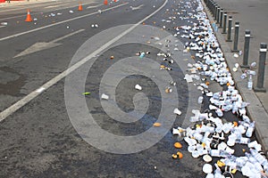 Empty used plastic glasses on the street