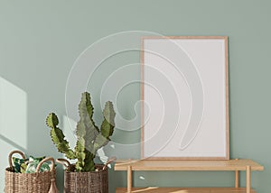 Empty vertical picture frame on light green wall in modern living room. Mock up interior in contemporary style. Free