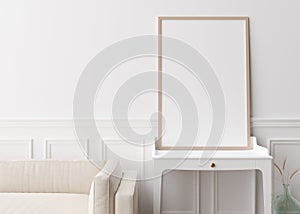 Empty vertical picture frame standing on console in modern living room. Mock up interior in contemporary style. Free