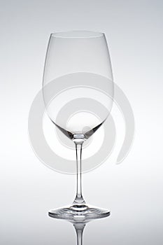 Empty vine glass on gradient background