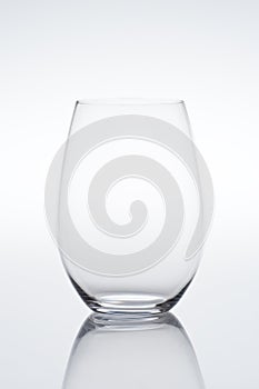 Empty vine glass on gradient background