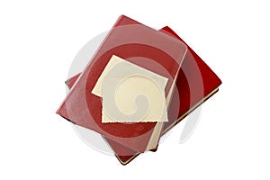 Empty vintage photo card over dark red covered retro albums