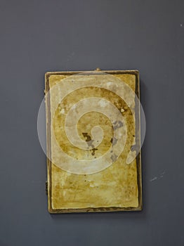 An empty vintage plate hanging on the wall