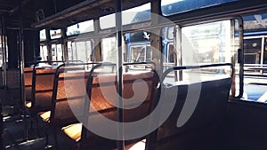 Empty vintage retro bus seats, sunbeam though window, local transport