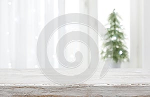 Empty vintage wood table in front of blurred holiday background