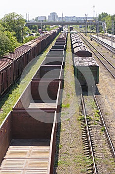 Empty wagons and freight wagons at a railway station