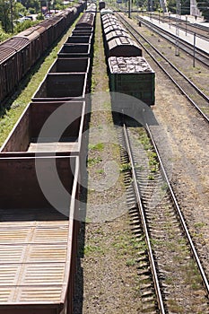 Empty wagons and freight wagons at a railway station. Different types of wagons.