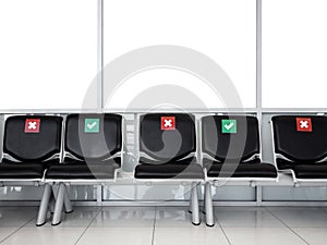 Empty waiting chairs with social distancing sign, green check mark and red cross mark