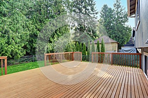 Empty walkout deck with redwood railings