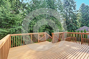 Empty walkout deck with redwood railings photo