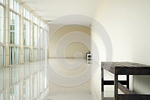 Empty walkway in building hall perspective with long white wall