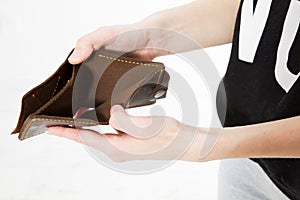 Empty wallet close up isolated on white. Bankruptcy concept copy space