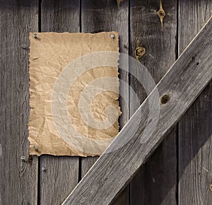 Empty Wanted poster on weathered plank wood door