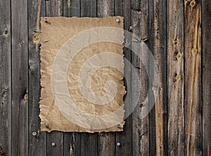 Empty wanted poster on weathered plank wood wall