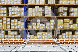 Empty warehouse shelves with defocused background