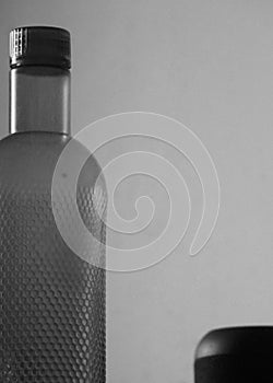Empty water bottle on plain background